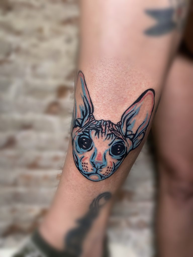 Small Tattoo of a cat